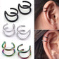 U-shape ear clip earrings set: black, silver and rainbow; one worn on an ear