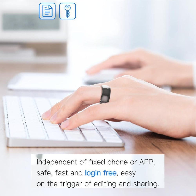 Glossy black smart ring worn on a person’s finger