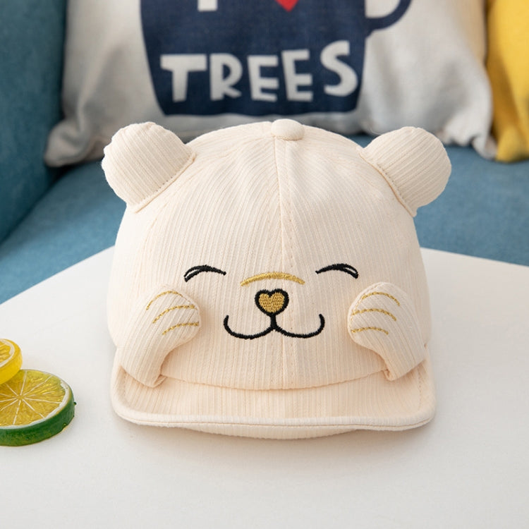 Beige baby sun hat with embroidered cat face and rounded ear side bumps