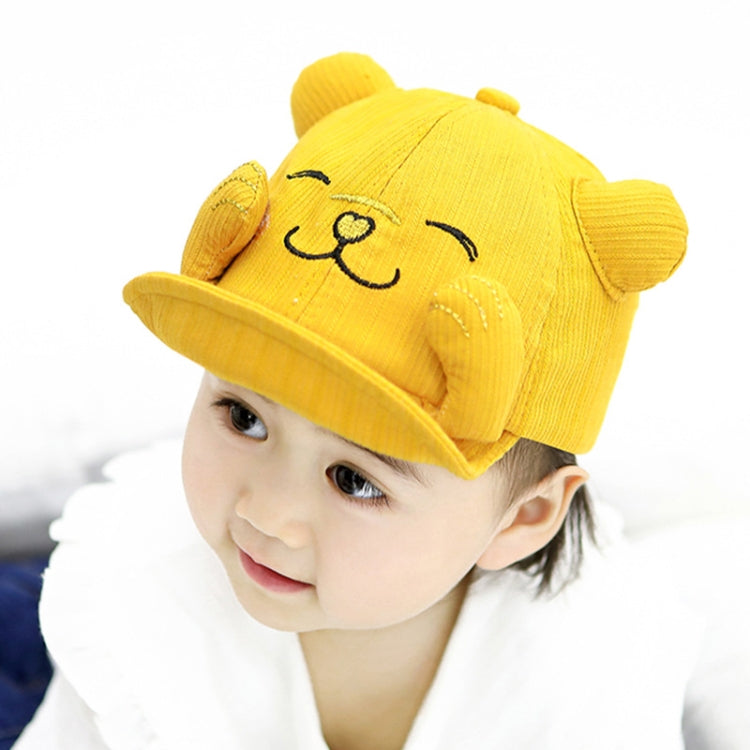 Yellow cartoon cat baby sun hat on a child, side view of embroidered face