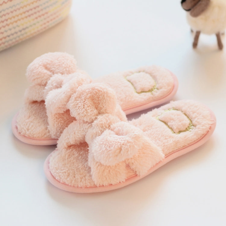 Light pink plush slide slippers with knotted bow and stitched heart on top