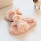 Light pink plush slide slippers with soft knotted bow and heart patch