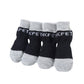 Set of four black and gray cotton anti-scratch dog socks with ribbed cuffs