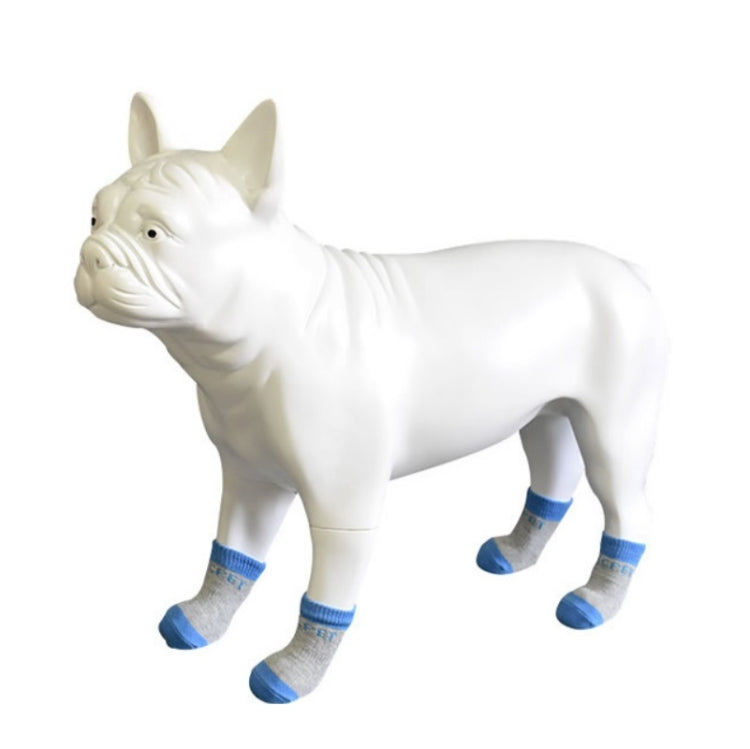White dog wearing blue and gray cotton anti-scratch socks, 4-pack