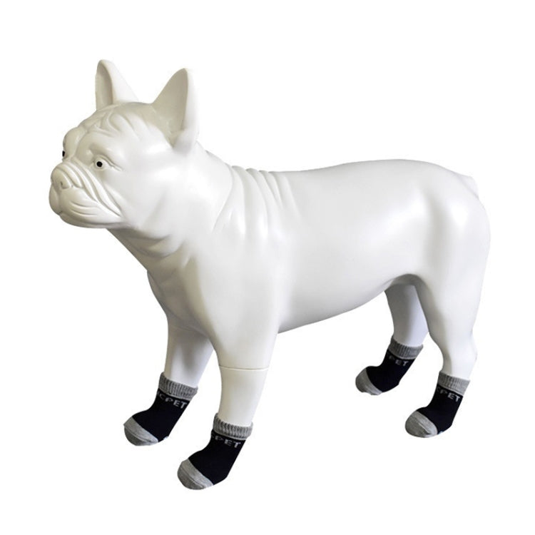 Side view: white dog wearing black and gray cotton anti-scratch socks, 4-pack