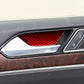 Installed red carbon-fiber style inner door handle trim sticker on car door panel