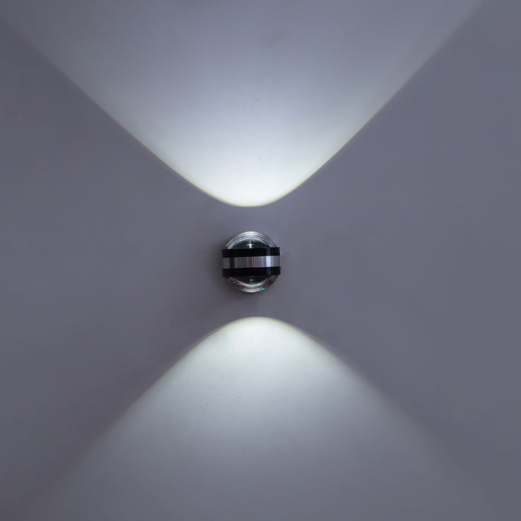 Up-down LED wall lamp, chrome round mount, two cool-white light beams