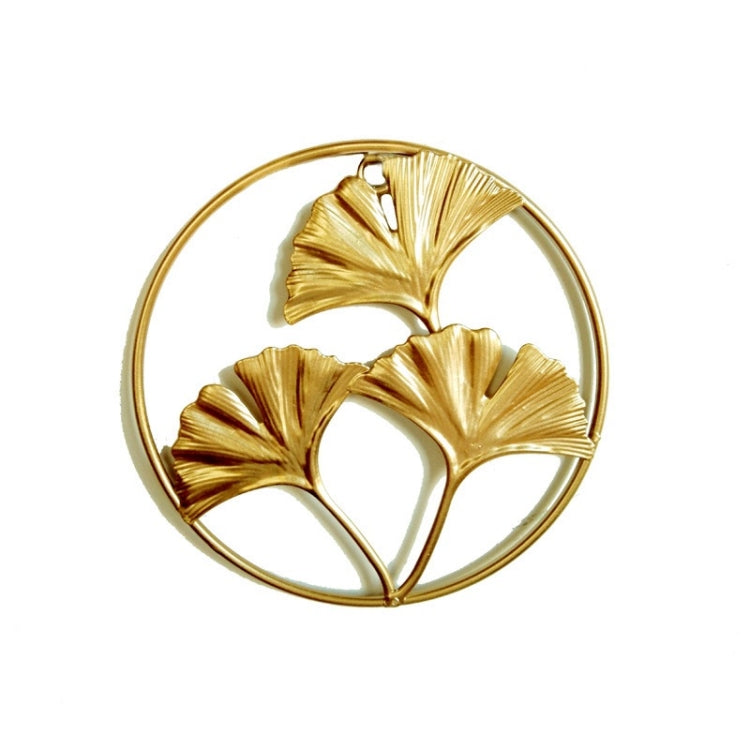 Gold 3D iron leaf wall hanging with round ring and three ginkgo tree silhouettes