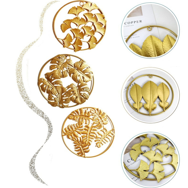 Gold 3D iron leaf wall hangings in round frames with multiple leaf patterns