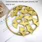 Gold 3D iron leaf wall hanging with round frame and layered ginkgo leaves detail