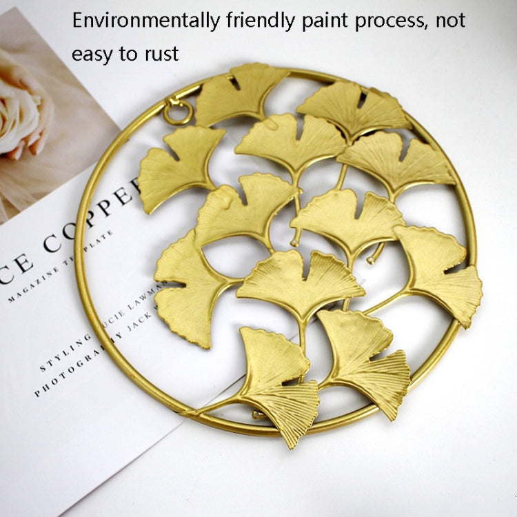 Gold 3D iron leaf wall hanging with round frame and layered ginkgo leaves detail