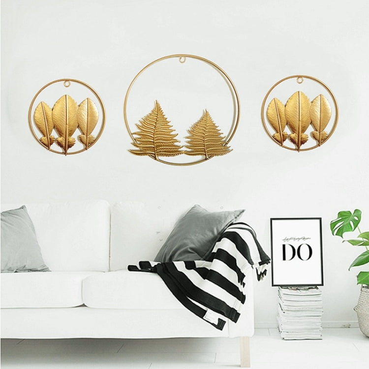 Set of three gold 3D iron leaf wall hangings in round frames
