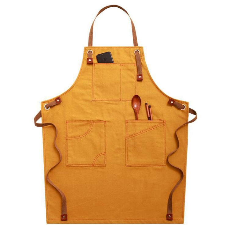 Yellow work apron with front pockets, chest strap, and metal-ring loops