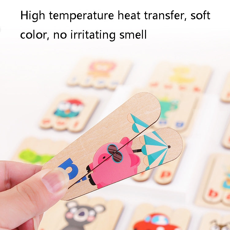 Wooden alphabet ice cream stick puzzle held in hand with other word cards