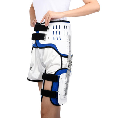 Hip fixation brace with white rigid shell, blue padding, and black straps, worn on leg