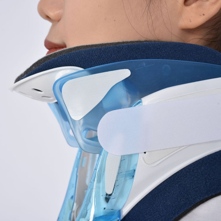 Close-up side of clear light-blue and white plastic neck brace with navy neck support