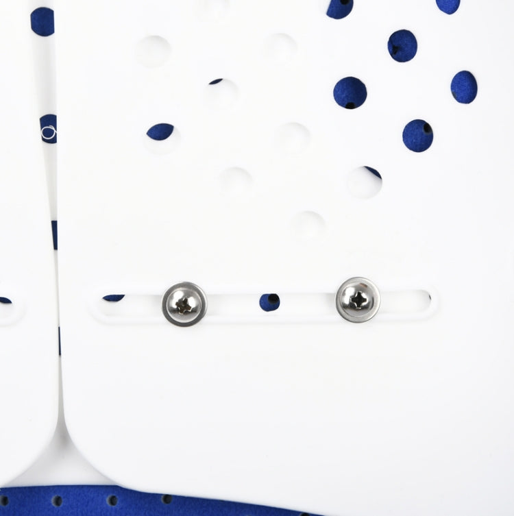 Close-up of thoracolumbar brace snaps on white panel with blue dot pattern