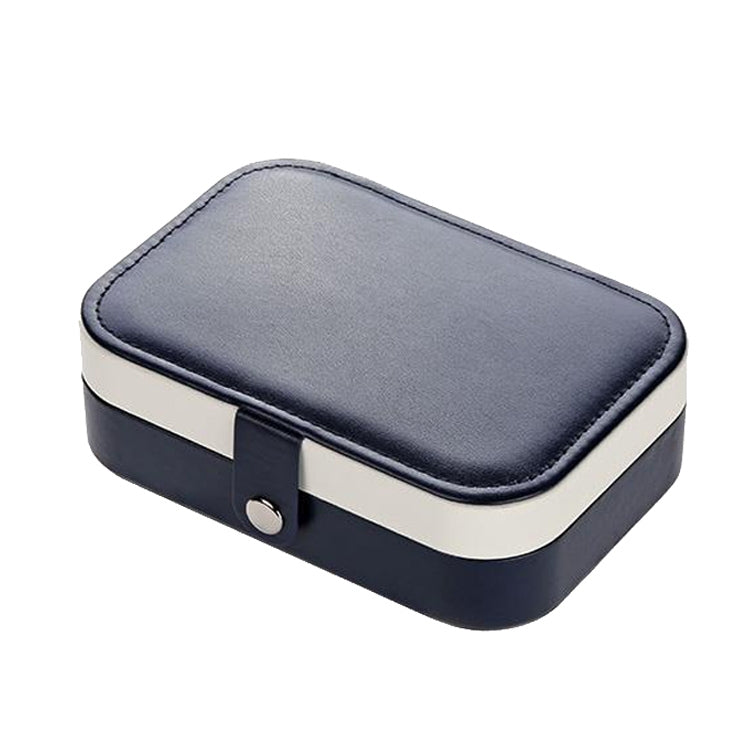 Portable jewelry storage box with navy faux-leather lid and snap clasp, cream base