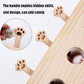 Wooden cloud cat puzzle toy with paw-shaped holes and a hidden fuzzy mouse ball.