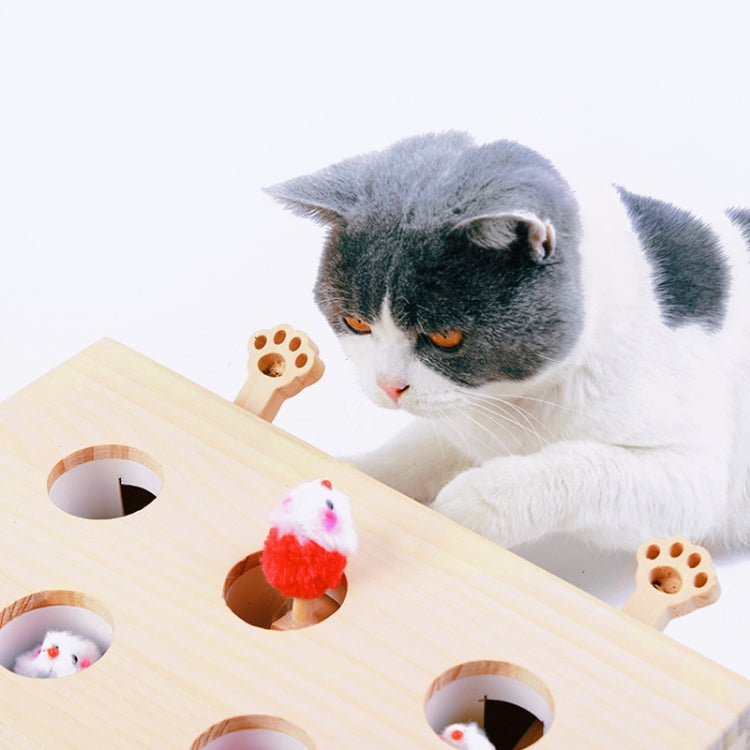 Wooden cat puzzle toy with paw-hole openings and a blue fuzzy mouse ball.
