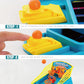 Close-up of blue mini basketball game with yellow launcher and orange ball ejection