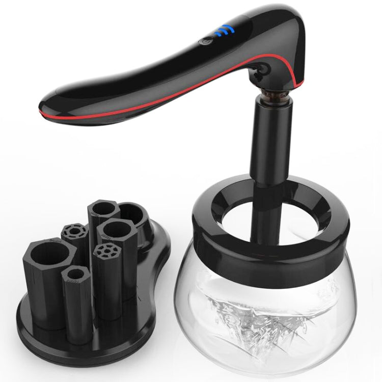 Makeup brush cleaner dryer with black top, gold nozzle, and clear mixing bowl base