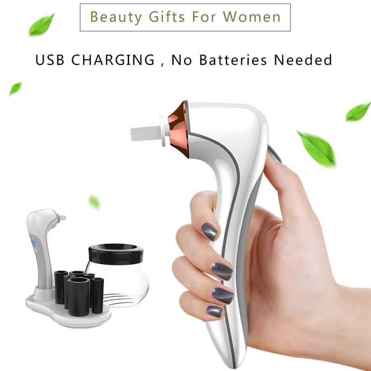 Hand holding white makeup brush cleaner and dryer unit with copper nozzle and black cup