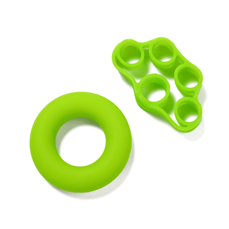 Green silicone finger trainer and grip loop ring, flat lay