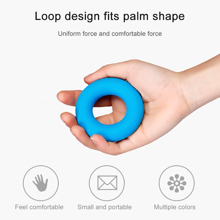 Blue silicone grip loop ring held in palm for hand exercise