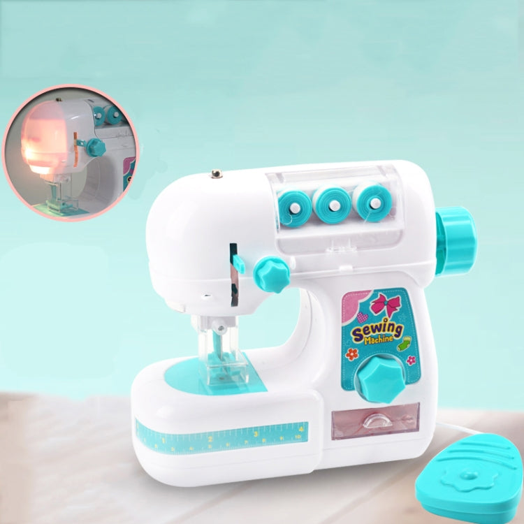 White and turquoise toy sewing machine with built-in teal lamp and visible needle