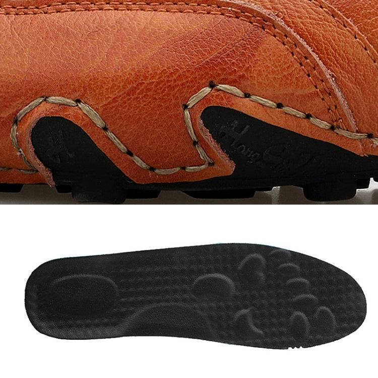 Orange leather sneaker upper and black outsole with tread pattern
