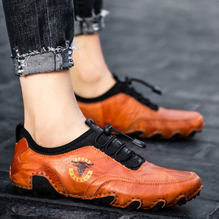 Orange leather casual sneakers with strap closure and rugged tread rubber sole