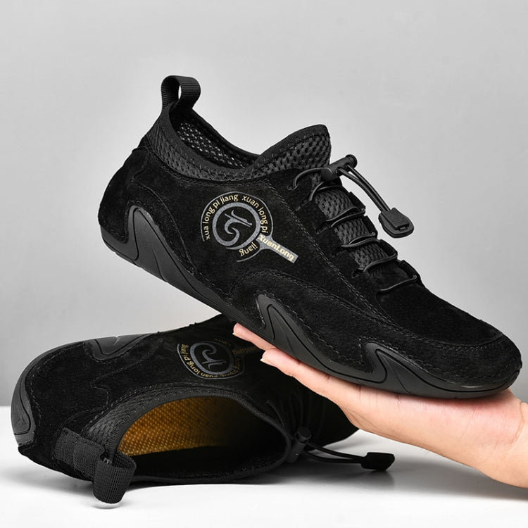 Black lace-up casual sneakers, side view with rubber-texture sole.