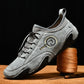 Men's gray lace-up sneakers with heel pull tab, logo patch, chunky rubber sole
