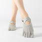 Light gray five-finger yoga socks with crisscross toe strap, full toe style