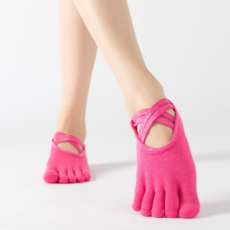 Hot pink five-finger yoga socks with crisscross strap over toes, full toe style