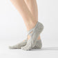 Light gray five-finger socks with crisscross strap, showing toe separation