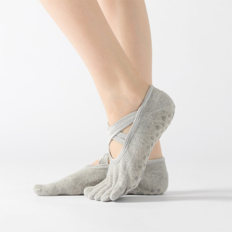 Light gray five-finger socks with crisscross strap, showing toe separation