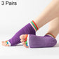 Purple open-toe five-finger yoga socks with dotted grip sole and rainbow cuffs