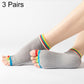 Gray open-toe five-finger yoga socks with dotted anti-slip soles and rainbow cuffs