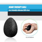 Black therapy ball with textured surface for hand squeezing resistance training