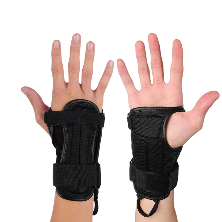 Two hands wearing black palm guards with wrist straps and open thumb design