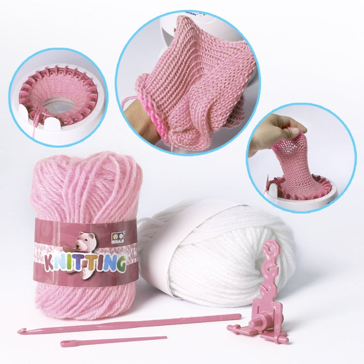 Knitting loom toy with pink yarn skein, white yarn, and knitting tools