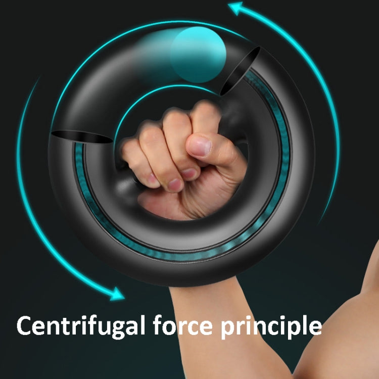 Black wrist power ball held in hand with glowing turquoise LED ring