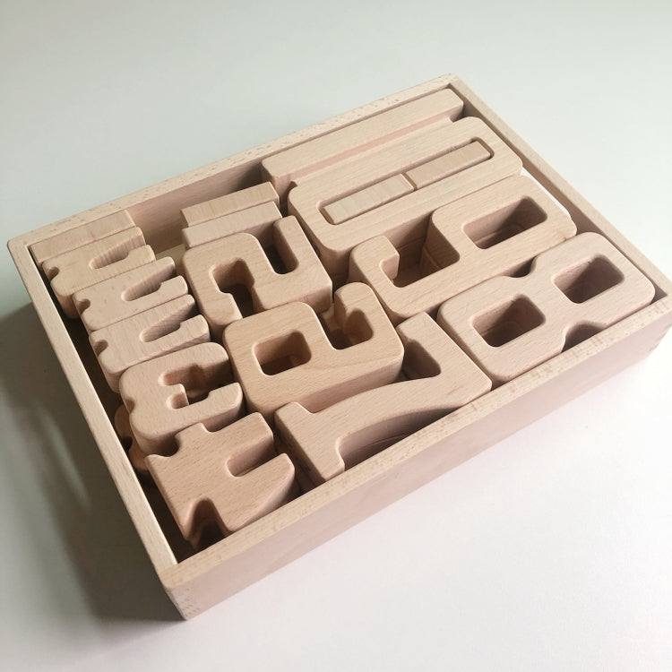 Wooden number blocks in a wooden tray, showing digit shapes with cutout centers