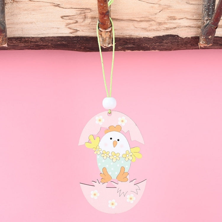 Easter wooden egg pendant with yellow chick and flowers around an egg