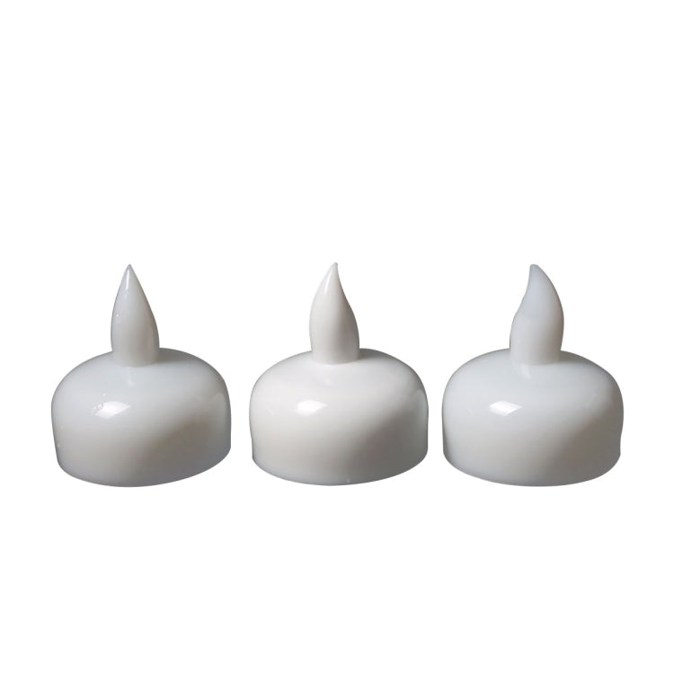 Set of LED floating candles with glossy white bodies and flame tips