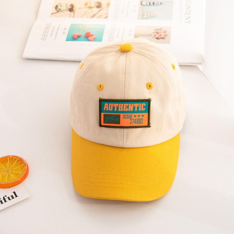 Kids baseball cap with beige crown, yellow brim, and “AUTHENTIC” front patch