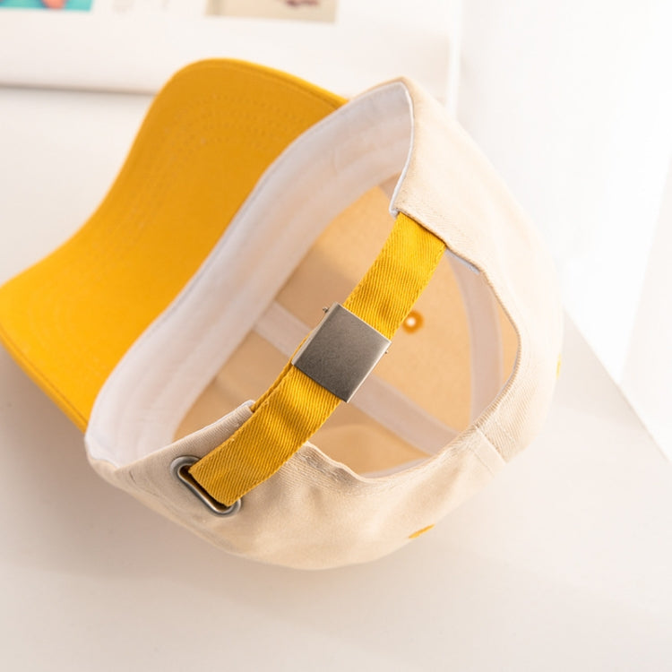 Kids cap interior with adjustable strap and metal buckle; yellow brim detail