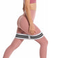 Gray resistance loop band with black striped bands worn around thighs